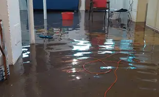 Basement with boiler, cabinets and washing machine completely flooded in Des Moines, IA