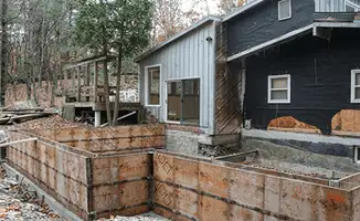 Prepared site with foundation forms for home remodeling and addition project in Des Moines, IA